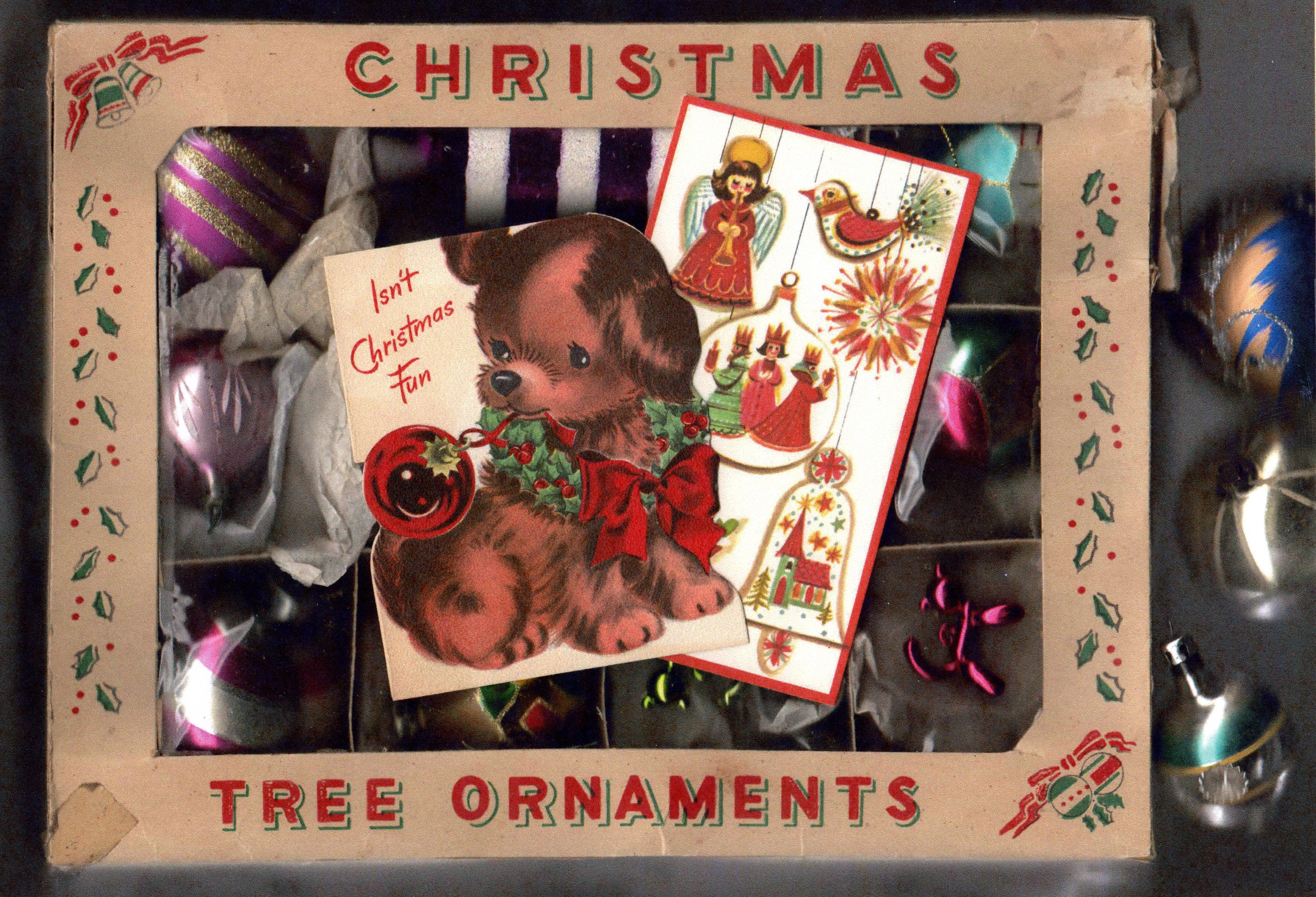 Vintage Christmas tree ornament set with a box featuring a dog illustration and text.