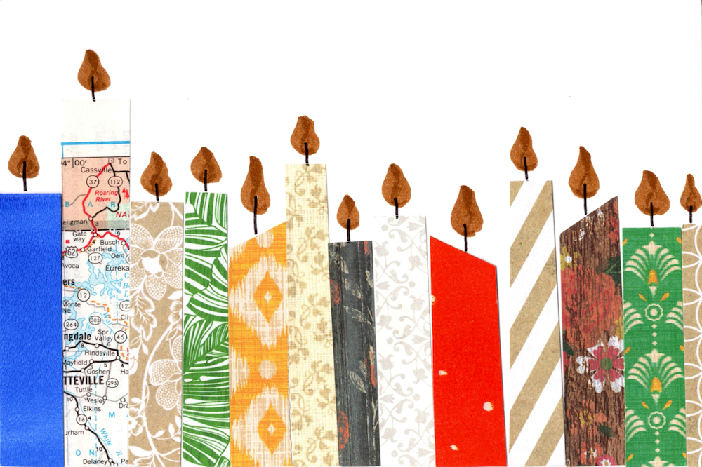 Decorative candles with various patterns and designs on a white background